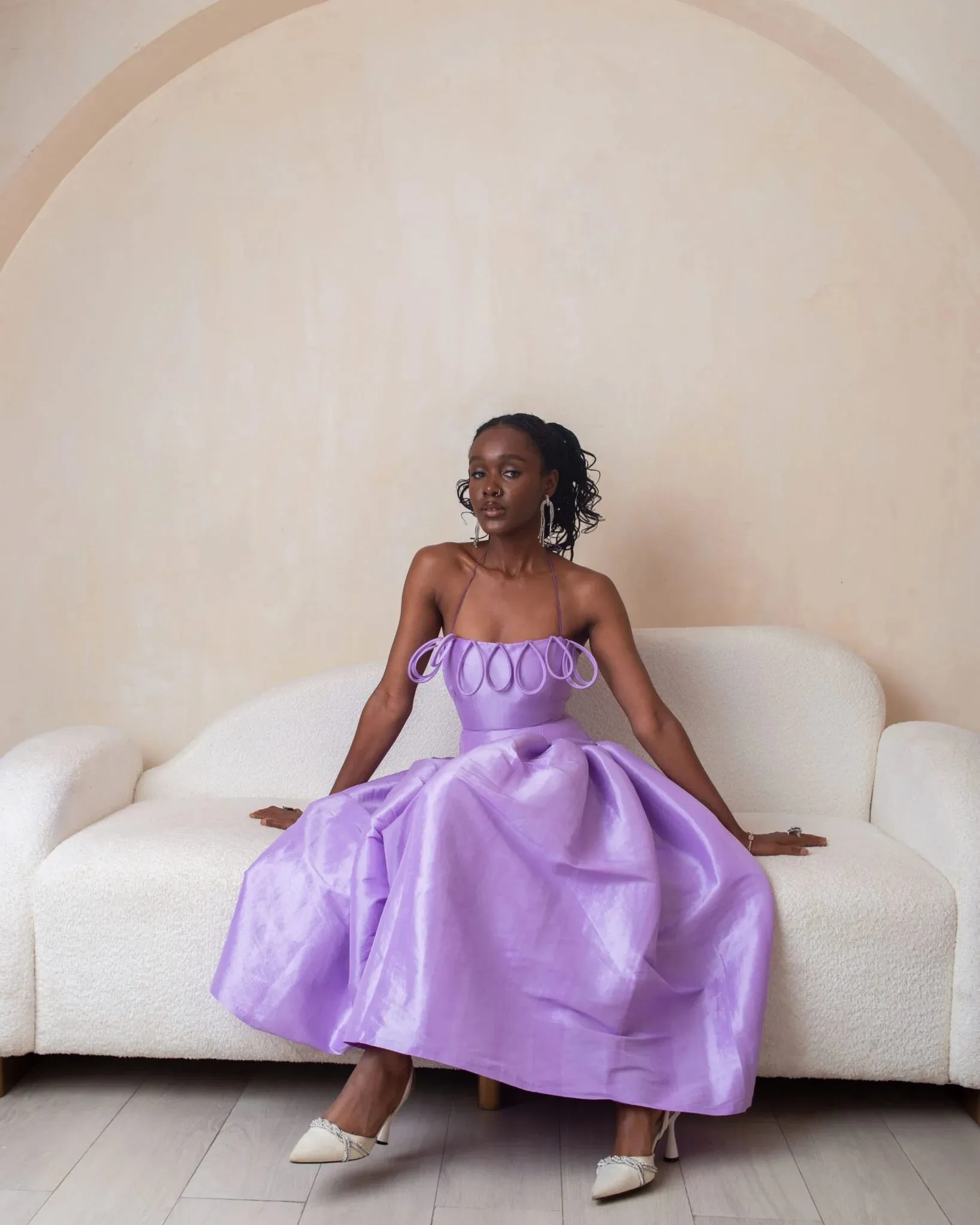 Desiree Iyama Meraki Midi Dress with Features a fitted bodice, elastic halterneck, exaggerated ovals at chest, back invisible zip