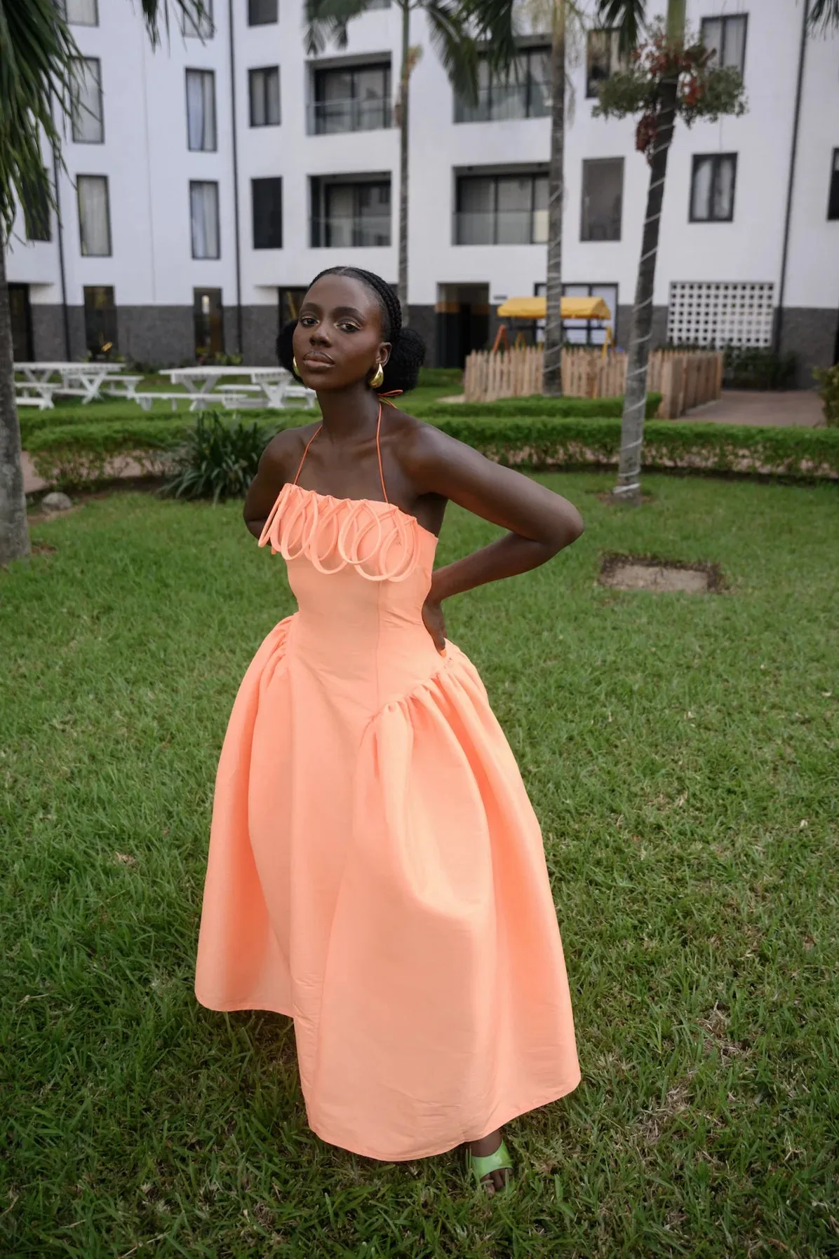 Desiree Iyama Meraki Midi Dress with Features a fitted bodice, elastic halterneck, exaggerated ovals at chest, back invisible zip