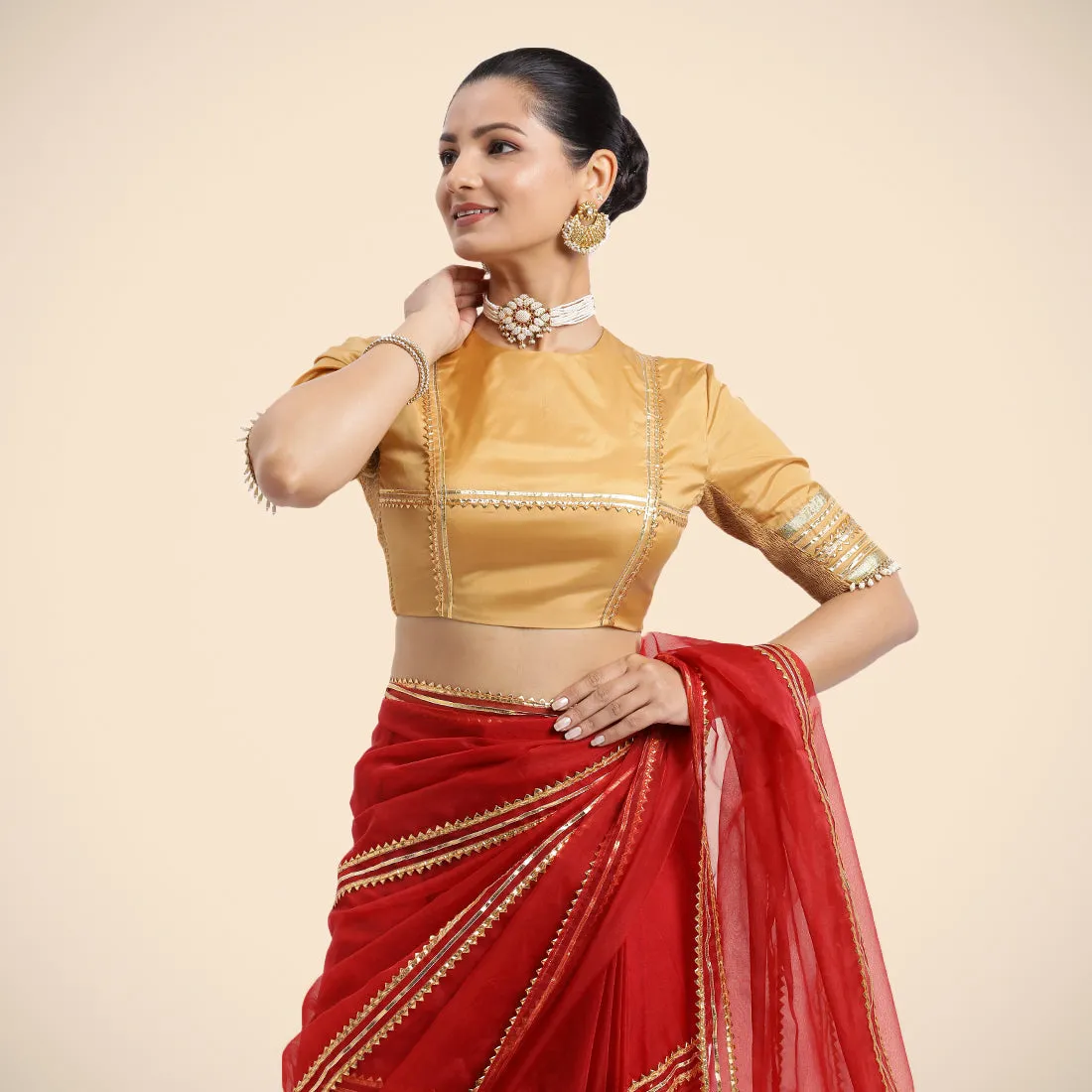 Farheen x Tyohaar | Gold Embellished Elbow Sleeves FlexiFit™ Saree Blouse with Zero Neck with Back Cut-Out and Golden Gota Embellishment